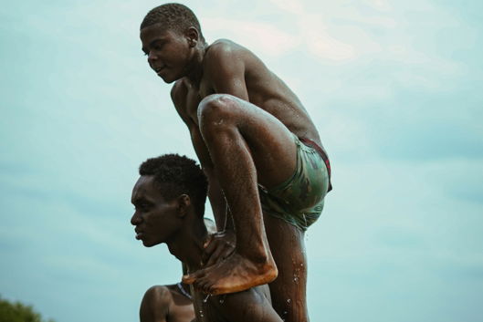 a man holding a child in water